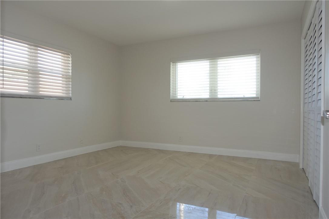 1311 Southwest 12th Avenue Boca Raton, FL 33486 - Photo 22 of 66 an empty room with a window