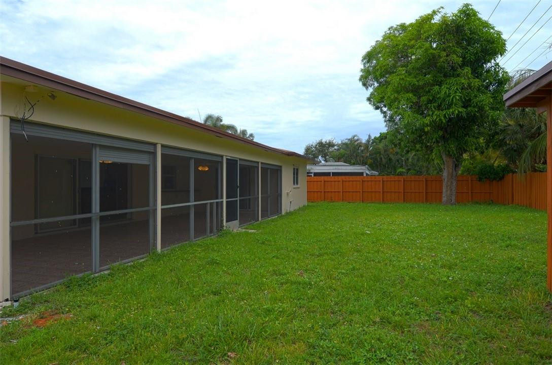1311 Southwest 12th Avenue Boca Raton, FL 33486 - Photo 24 of 66 a view of a backyard with a large tree