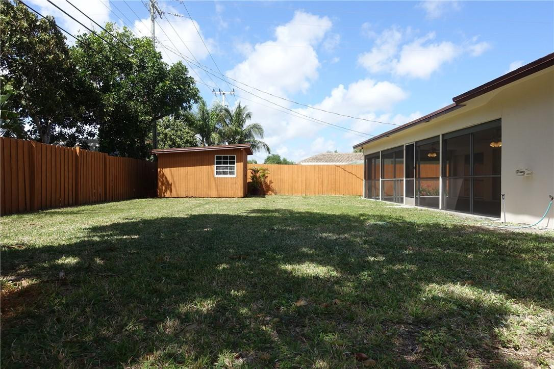1311 Southwest 12th Avenue Boca Raton, FL 33486 - Photo 25 of 66 a house view with a garden space