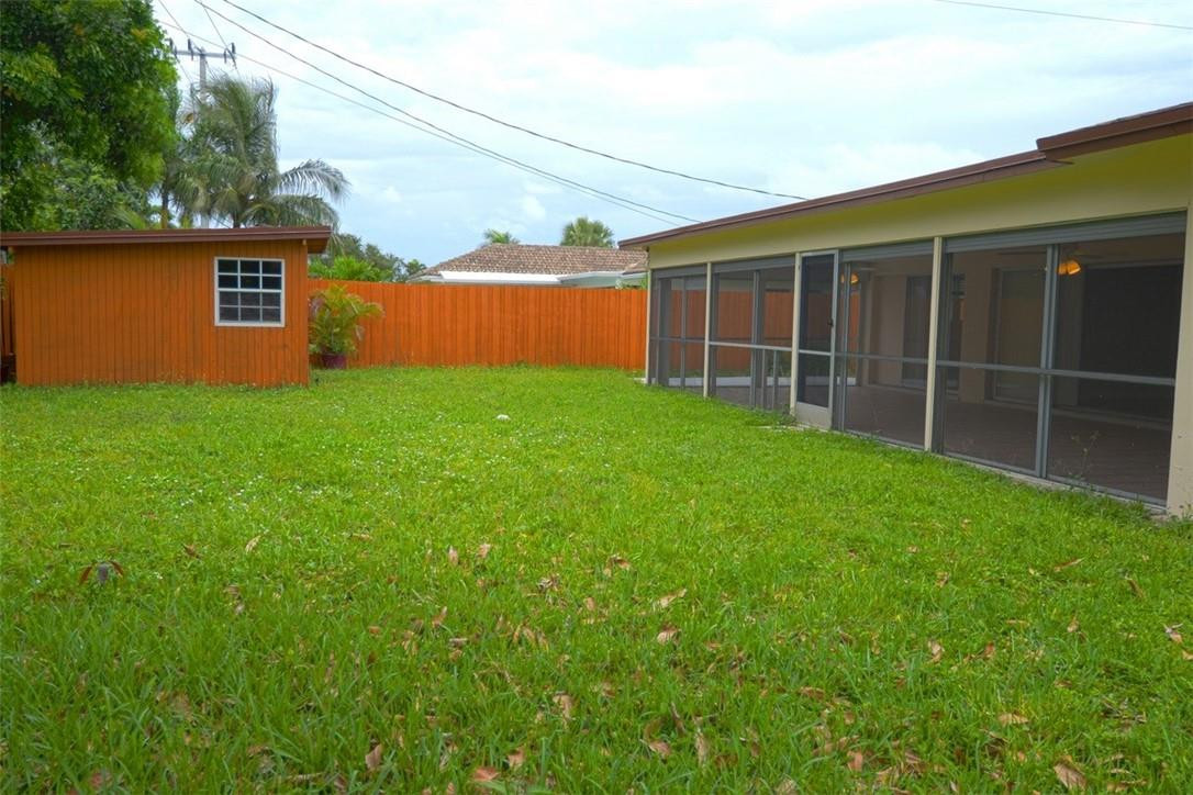 1311 Southwest 12th Avenue Boca Raton, FL 33486 - Photo 26 of 66 a view of a backyard with plants and large tree