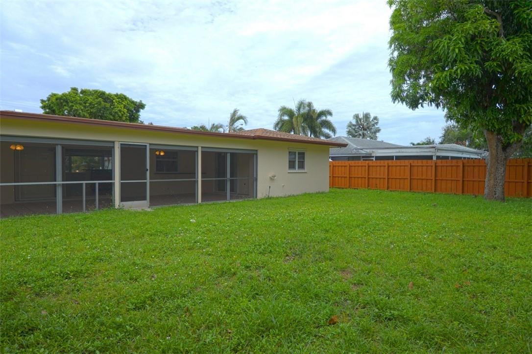 1311 Southwest 12th Avenue Boca Raton, FL 33486 - Photo 27 of 66 a view of an house with backyard space and balcony
