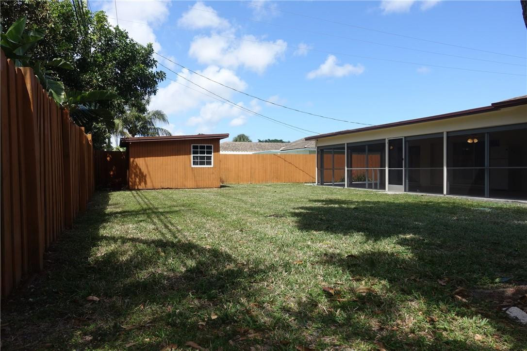1311 Southwest 12th Avenue Boca Raton, FL 33486 - Photo 29 of 66 a view of a house with backyard and garden