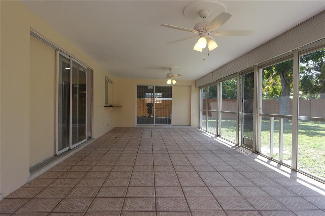 1311 Southwest 12th Avenue Boca Raton, FL 33486 - Photo 39 of 66 a view of empty room with windows and ceiling fan