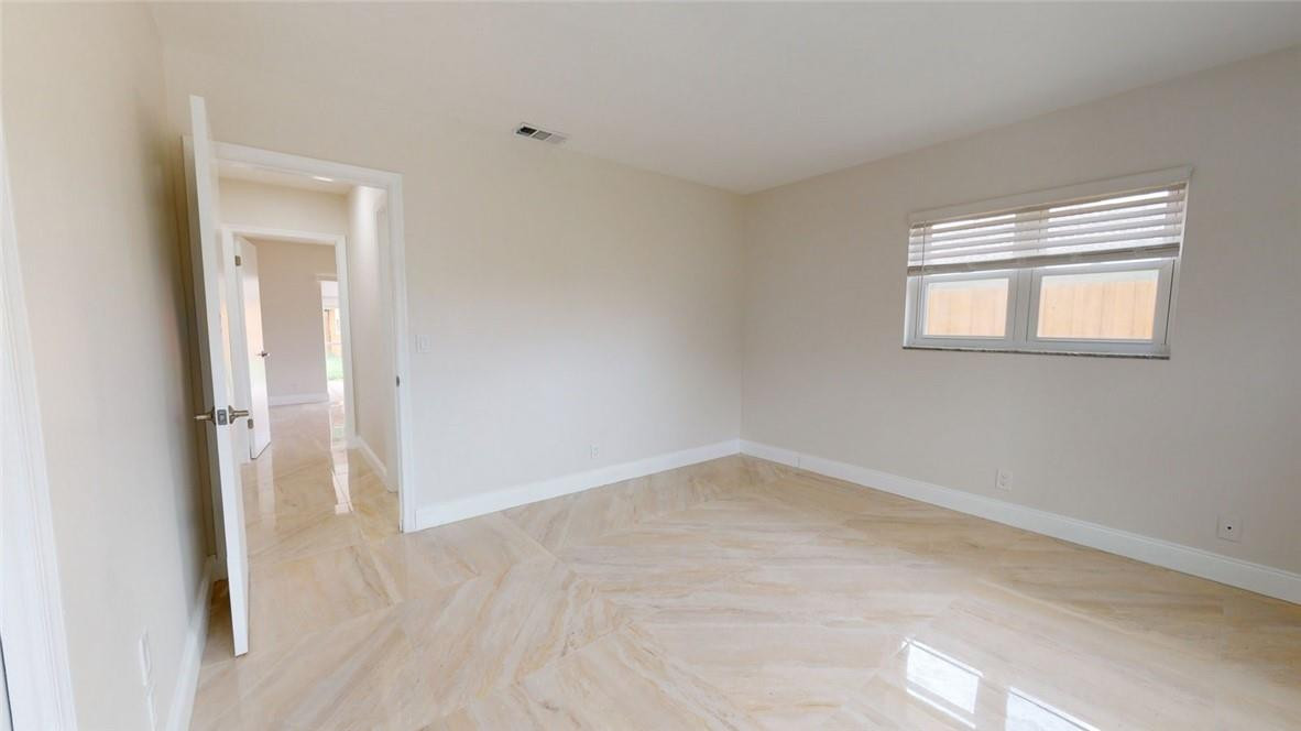 1311 Southwest 12th Avenue Boca Raton, FL 33486 - Photo 47 of 66 a view of an empty room with closet and a window