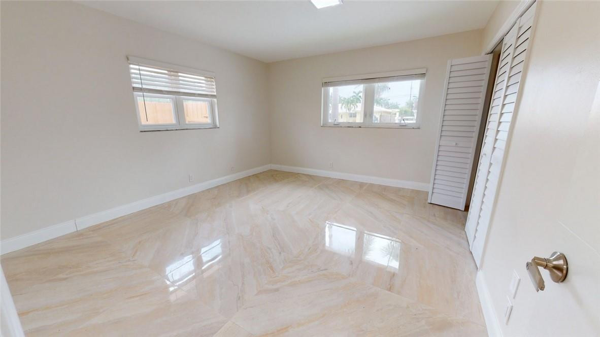 1311 Southwest 12th Avenue Boca Raton, FL 33486 - Photo 50 of 66 an empty room with windows