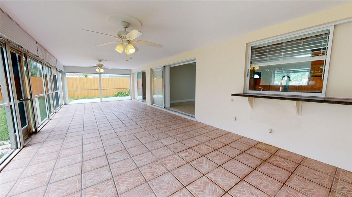 1311 Southwest 12th Avenue Boca Raton, FL 33486 - Photo 54 of 66 a view of a hallway with wooden floor and chandelier