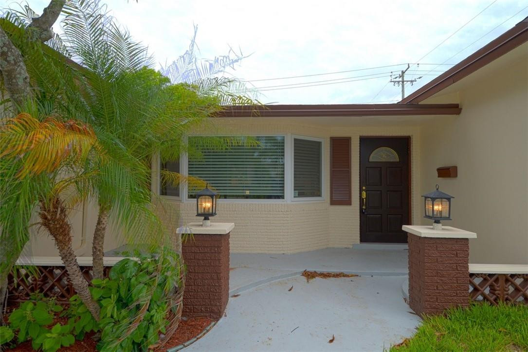 1311 Southwest 12th Avenue Boca Raton, FL 33486 - Photo 66 of 66 a front view of a house with garden