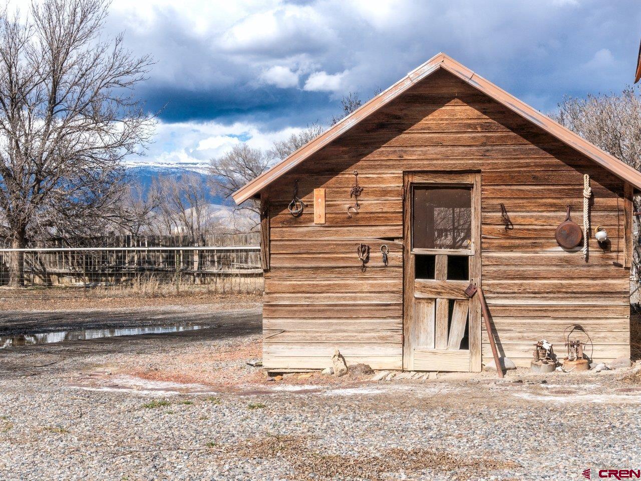 477 1600 Road Delta, CO 81416 - Photo 12 of 23 a front view of a house with a yard