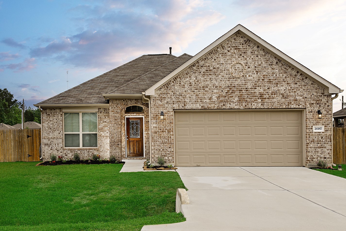 front view of a house with a yard
