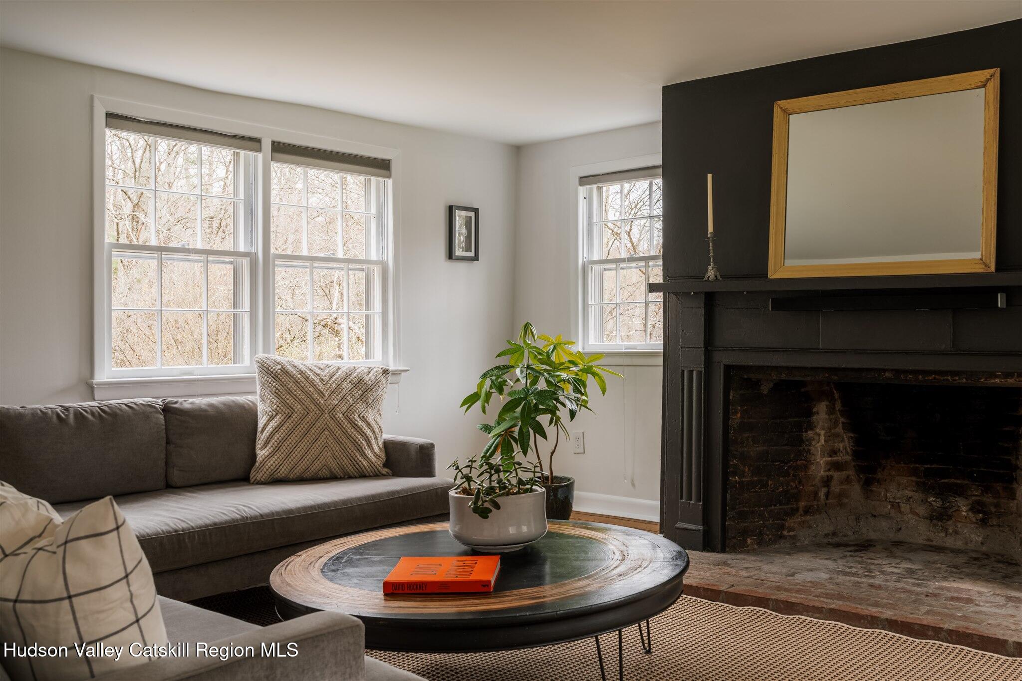 15 Dashville Road New Paltz, NY 12561 - Photo 11 of 38 a living room with furniture a window and a fireplace