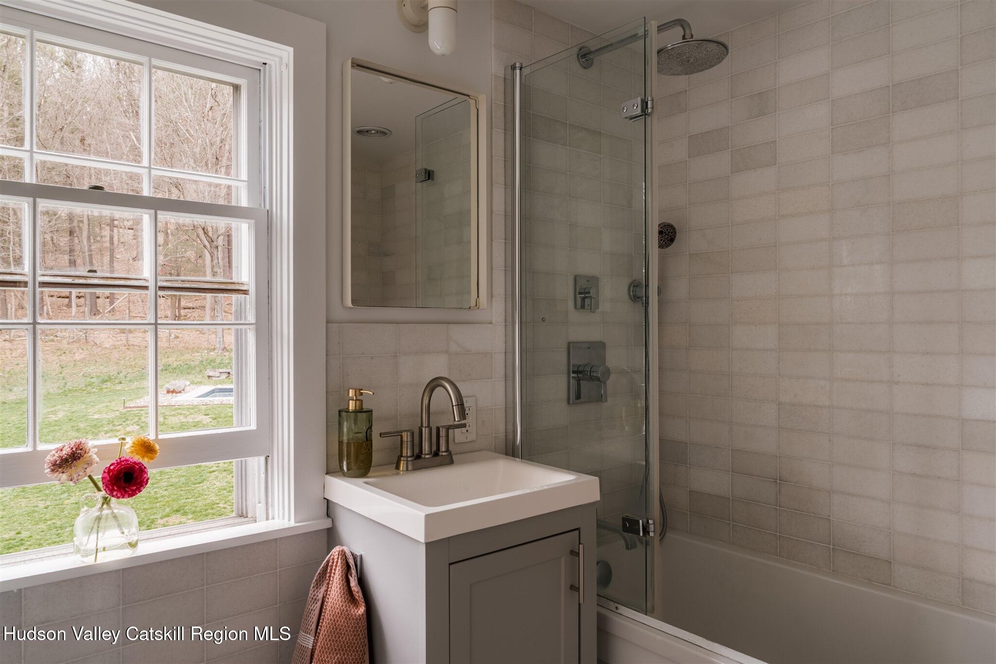 15 Dashville Road New Paltz, NY 12561 - Photo 26 of 38 a bathroom with a sink a toilet and shower