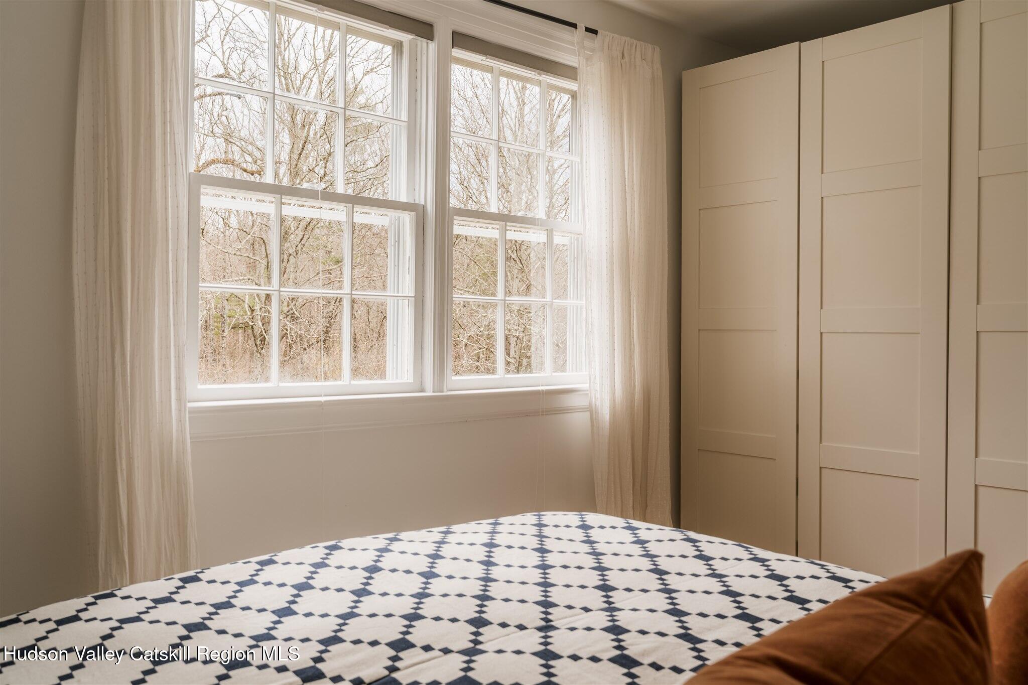15 Dashville Road New Paltz, NY 12561 - Photo 33 of 38 a bedroom with a bed and a window