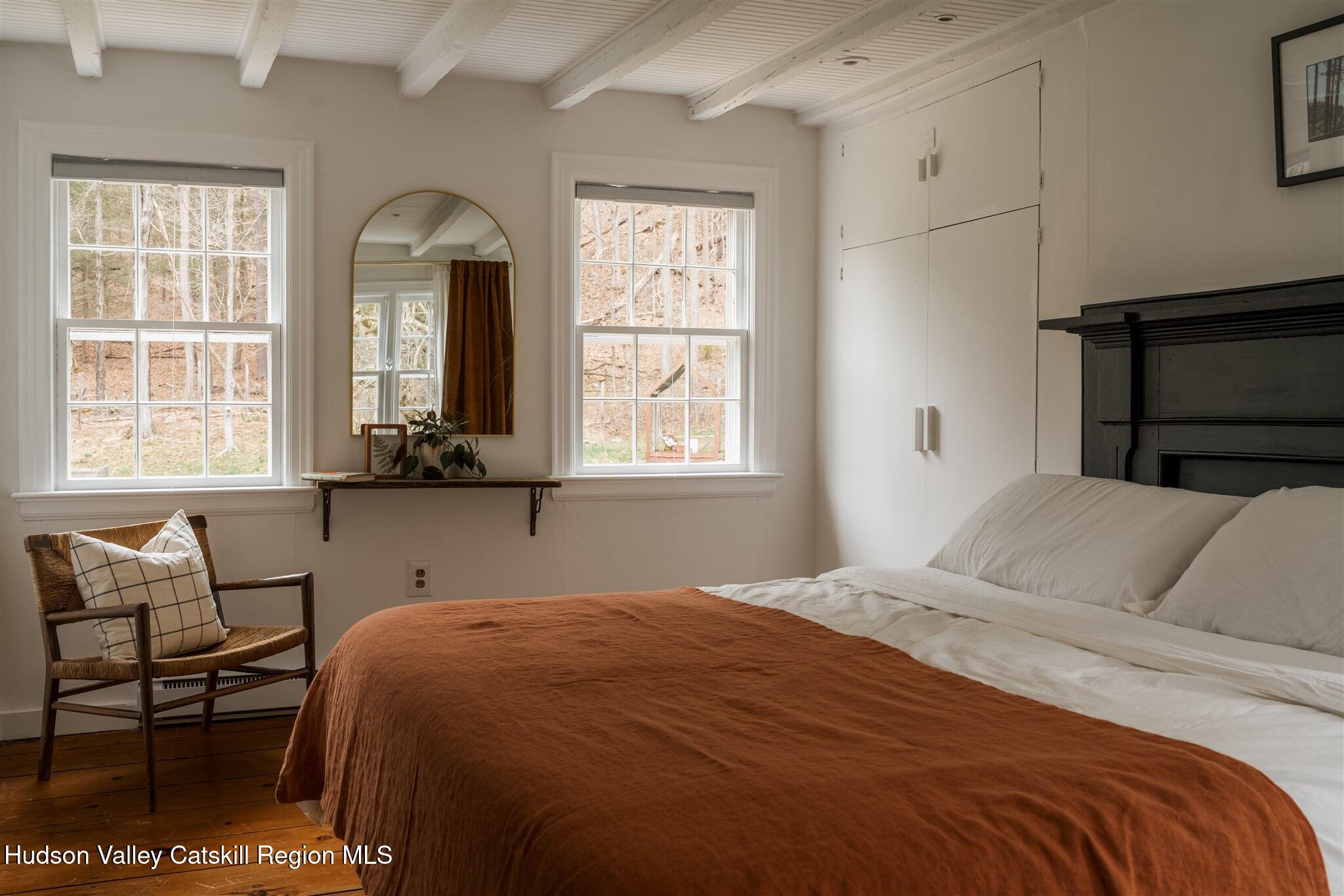 15 Dashville Road New Paltz, NY 12561 - Photo 7 of 38 a bedroom with a bed a table and chair