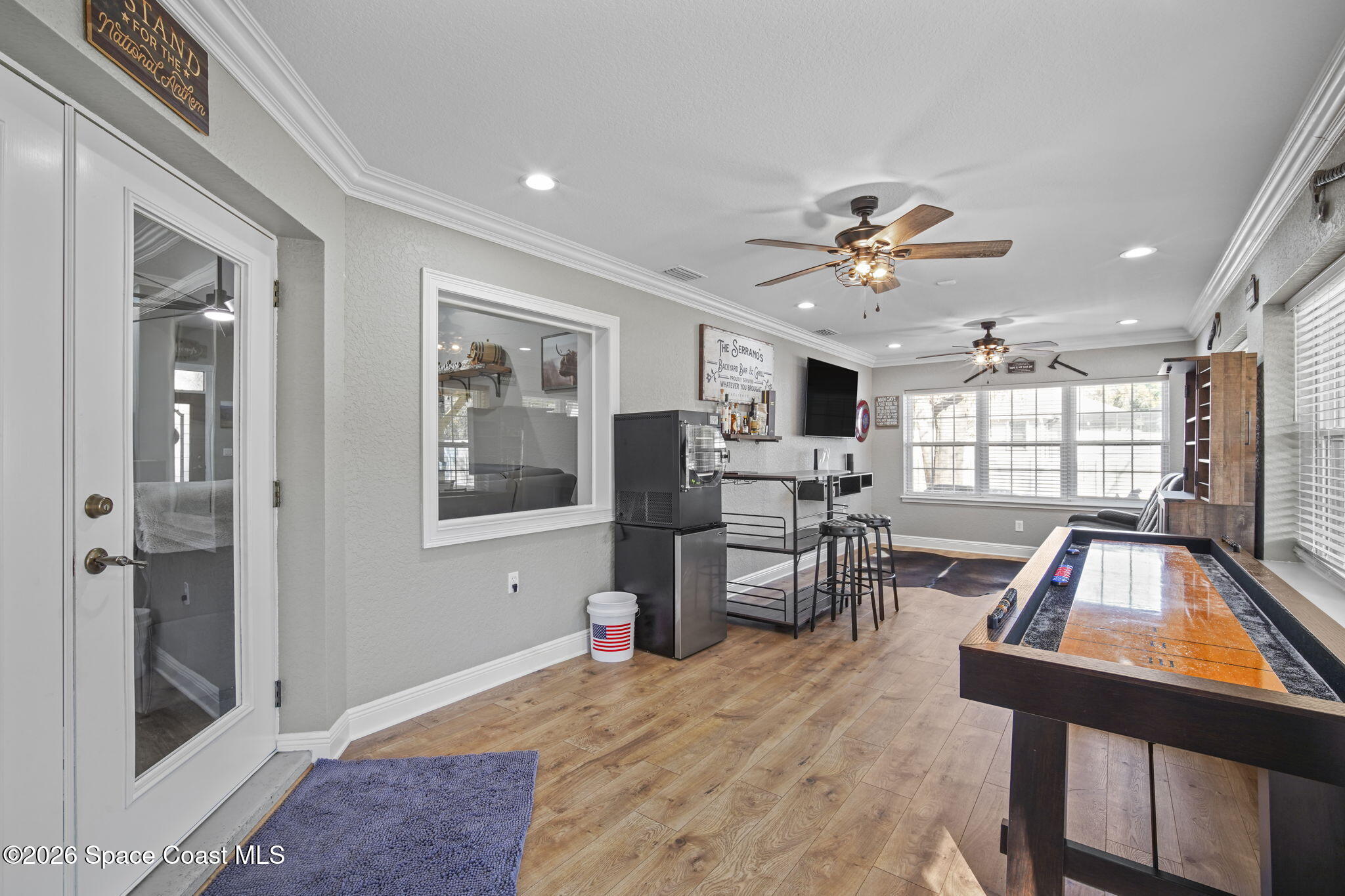 1845 Turpentine Road Mims, FL 32754 - Photo 15 of 33 a living room with furniture a flat screen tv and a table