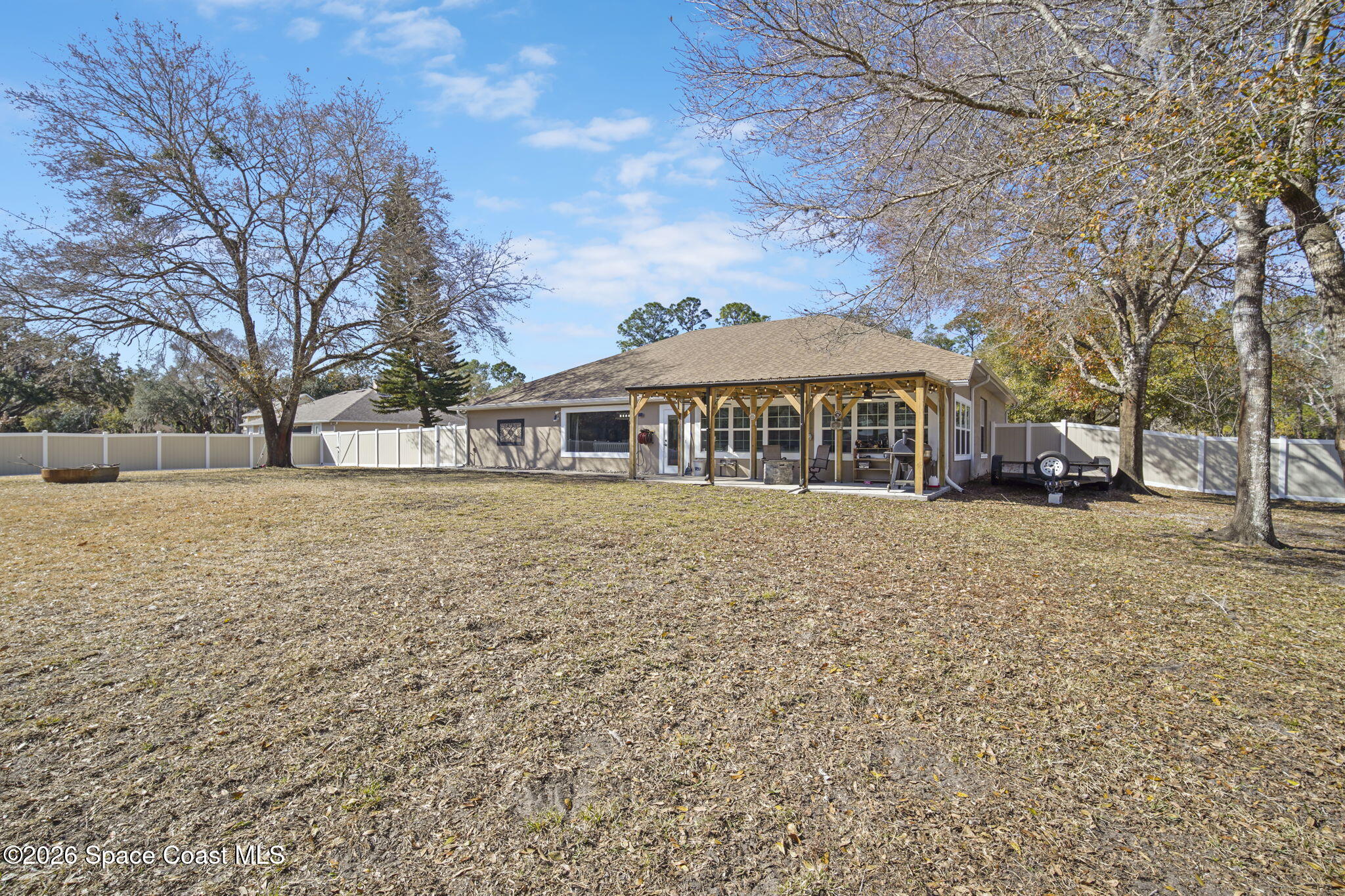 1845 Turpentine Road Mims, FL 32754 - Photo 20 of 33 a front view of a house with a yard covered with snow