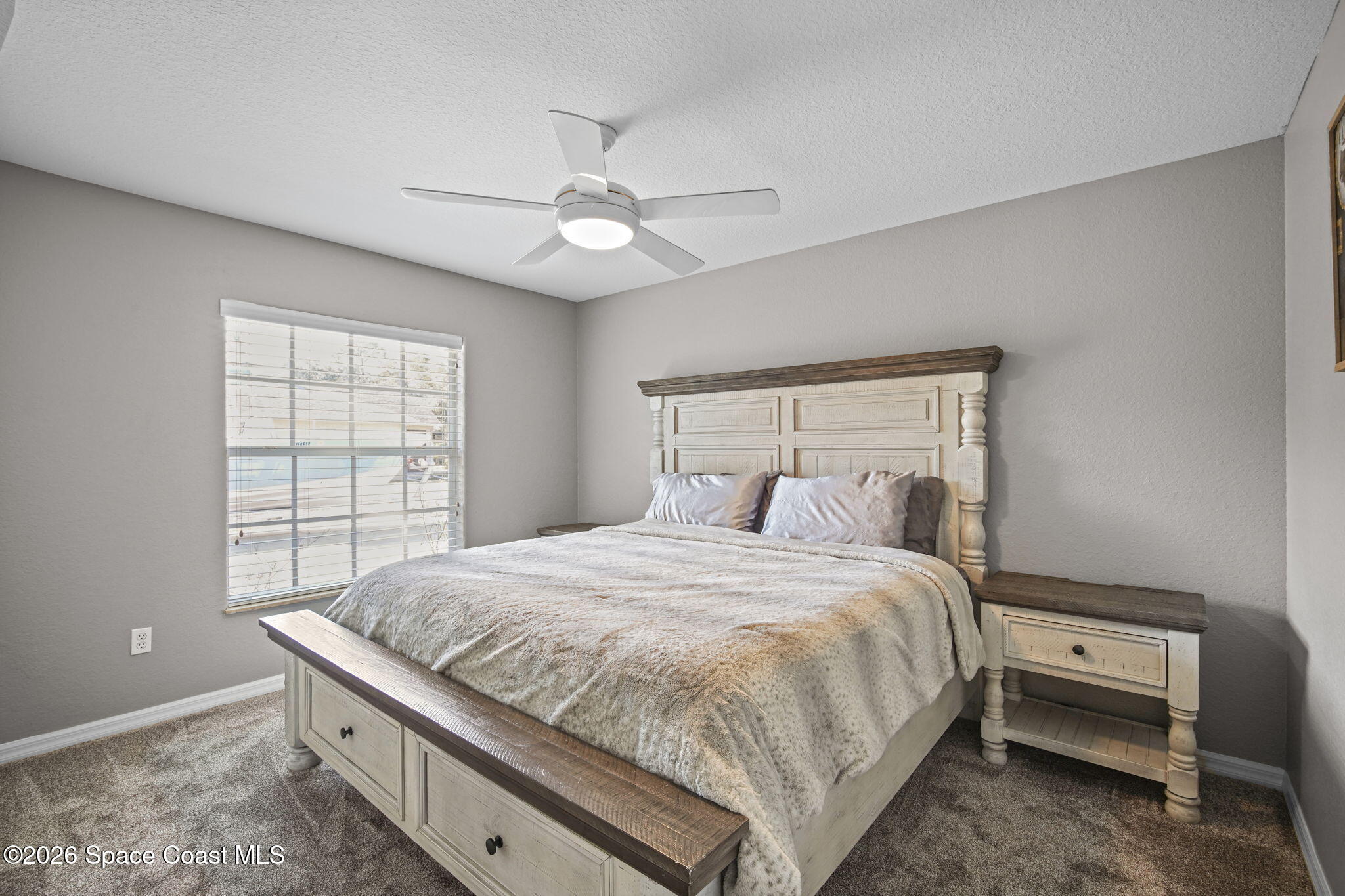 1845 Turpentine Road Mims, FL 32754 - Photo 21 of 33 a bedroom with a bed and a window