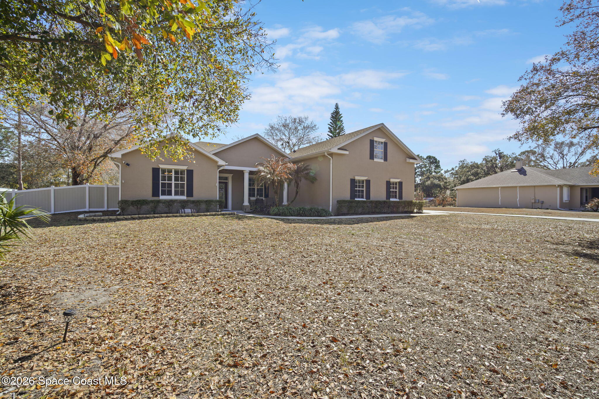 1845 Turpentine Road Mims, FL 32754 - Photo 4 of 33 a front view of a house with a yard