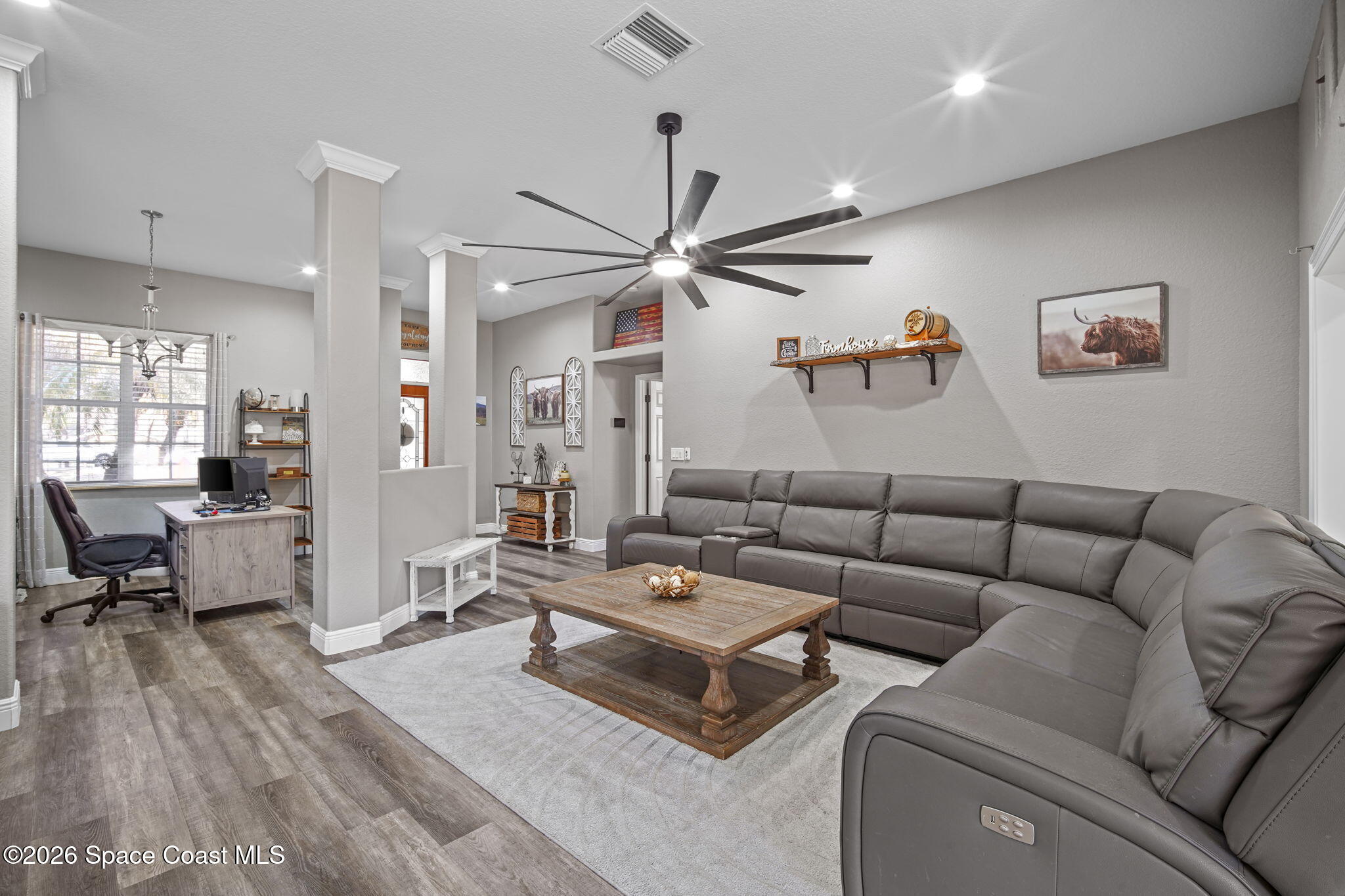 1845 Turpentine Road Mims, FL 32754 - Photo 7 of 33 a living room with furniture a table and wooden floor