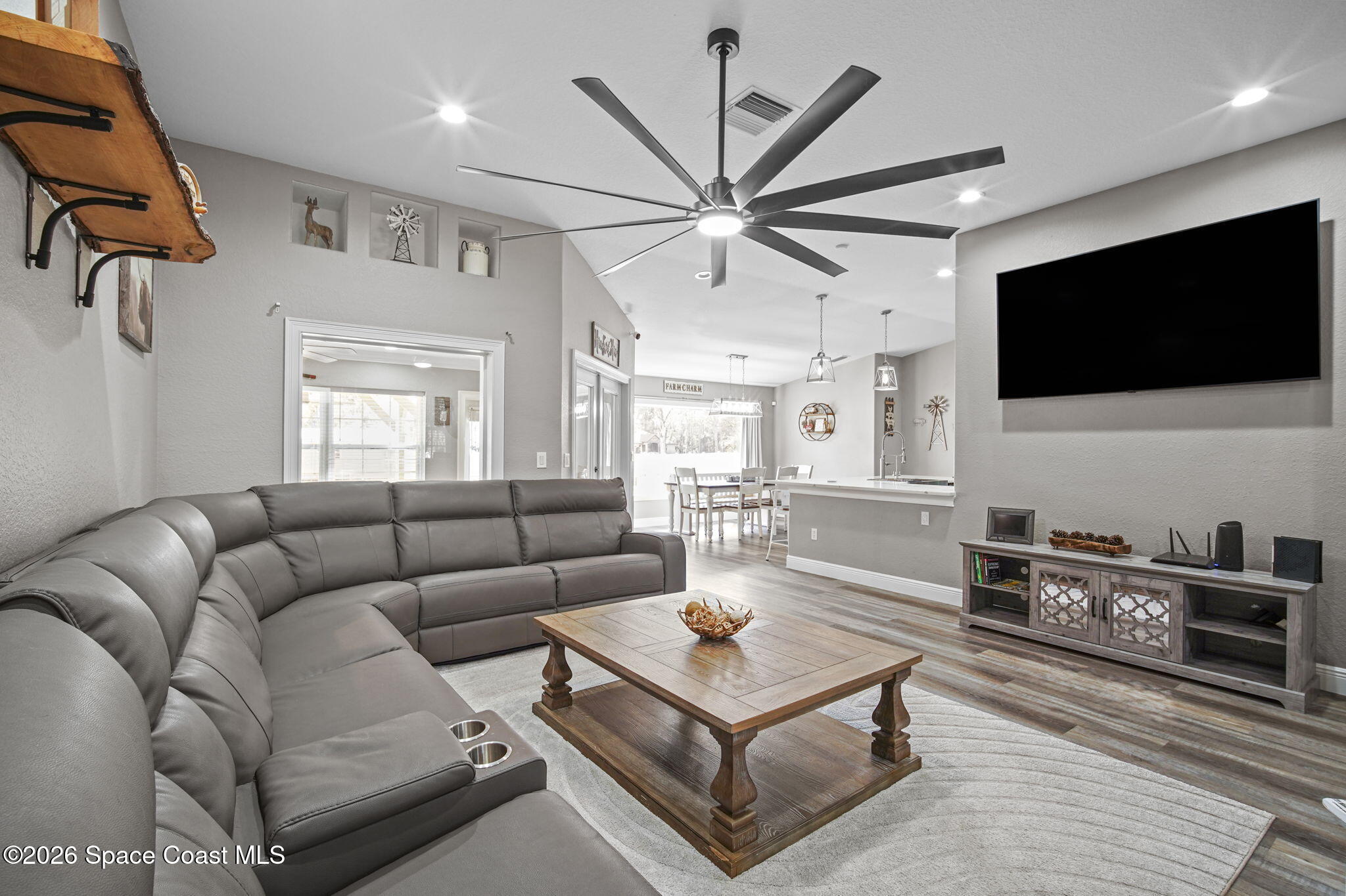 1845 Turpentine Road Mims, FL 32754 - Photo 8 of 33 a living room with furniture and a flat screen tv