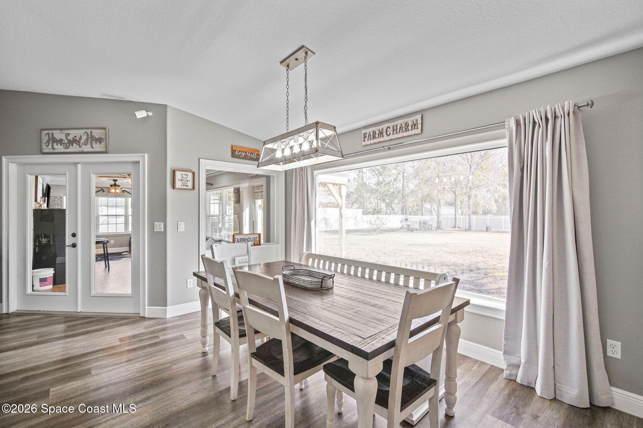 1845 Turpentine Road Mims, FL 32754 - Photo 9 of 33 a dining room with furniture window wooden floor