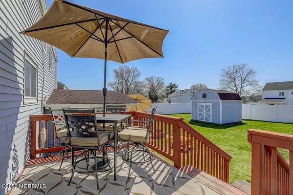an outdoor space with furniture and umbrella