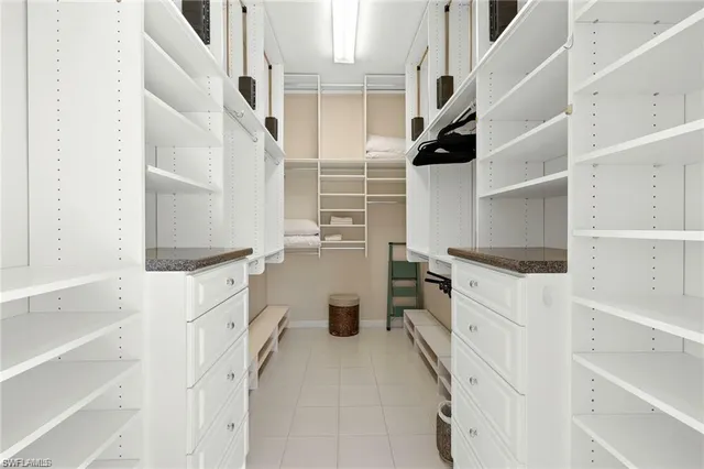 a spacious bathroom with a double vanity sink mirror and double
