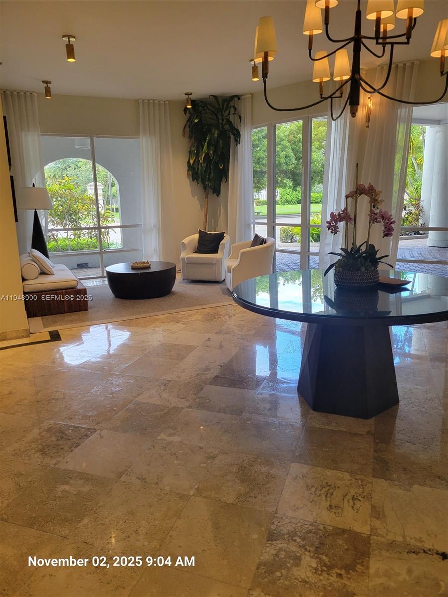 2351 Douglas Road, Unit 601 Miami, FL 33145 - Photo 2 of 36 a view of a living room and a floor to ceiling window