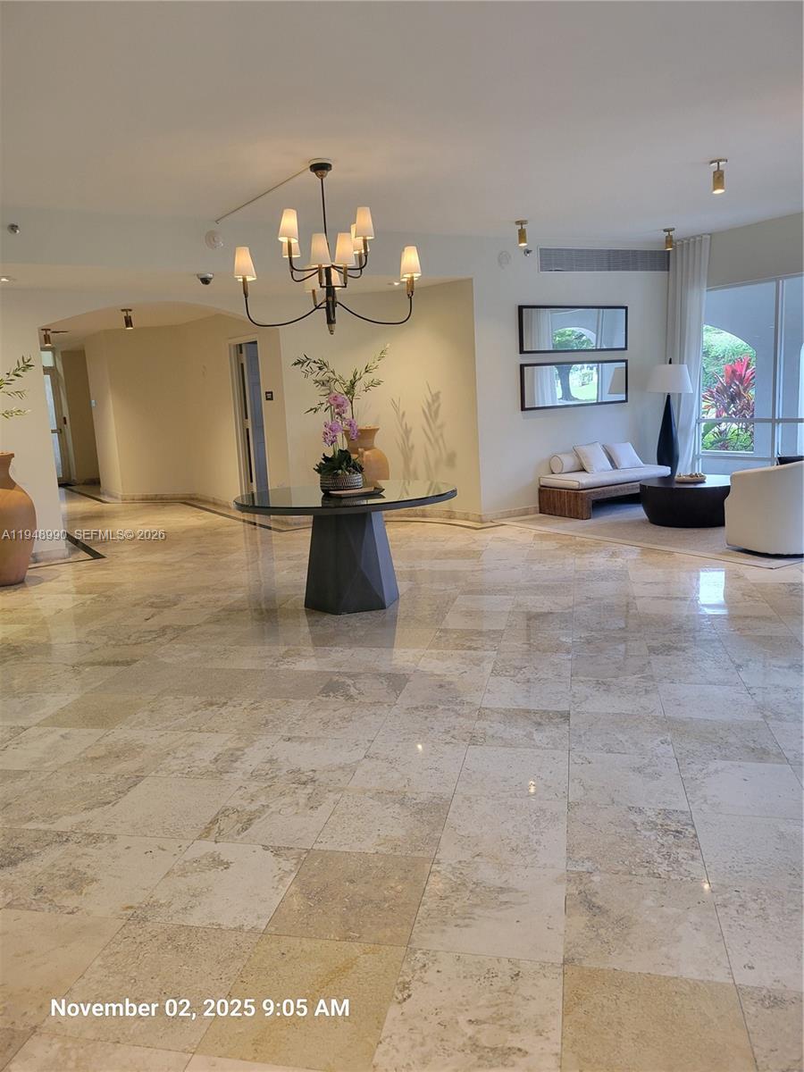 2351 Douglas Road, Unit 601 Miami, FL 33145 - Photo 23 of 36 a view of a room with kitchen and dining table cabinet