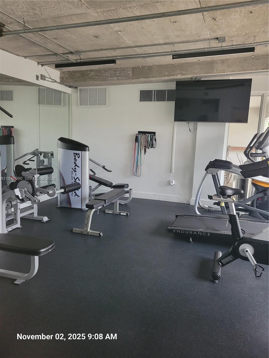 2351 Douglas Road, Unit 601 Miami, FL 33145 - Photo 30 of 36 a view of a room with gym equipment