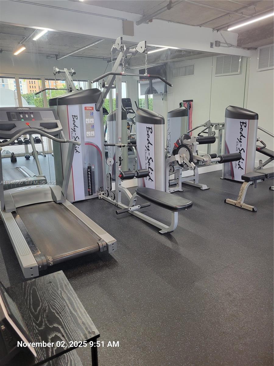 2351 Douglas Road, Unit 601 Miami, FL 33145 - Photo 31 of 36 a view of a room with gym equipment