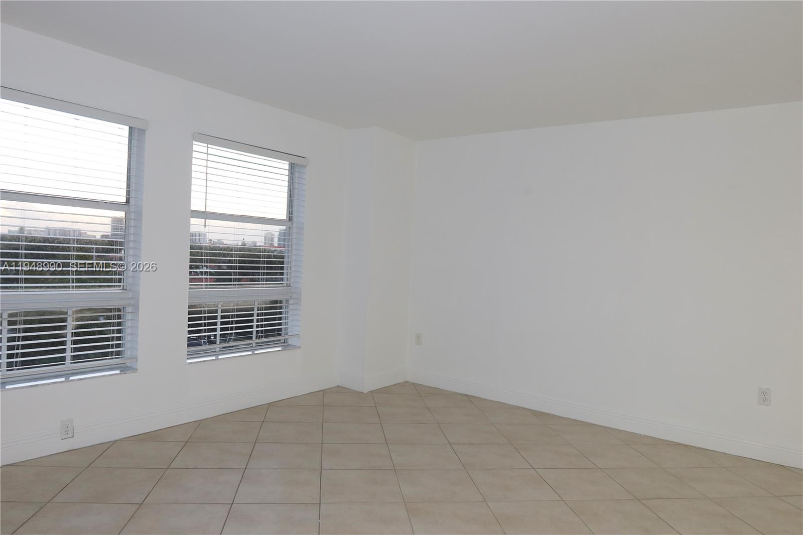 2351 Douglas Road, Unit 601 Miami, FL 33145 - Photo 9 of 36 a view of an empty room with a window