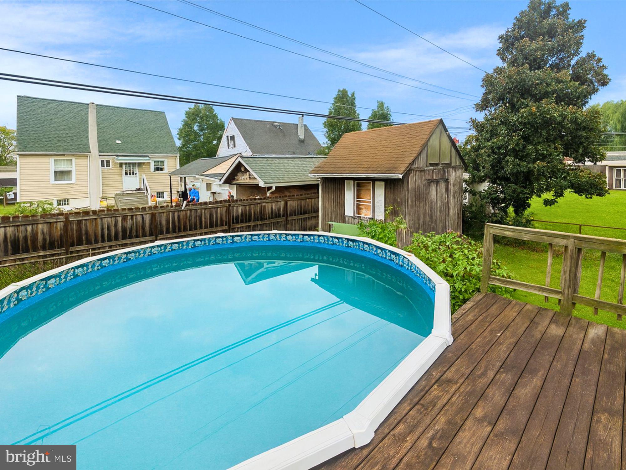 1747 Brookview Road Baltimore, MD 21222 - Photo 12 of 13 a view of a house with pool and chairs