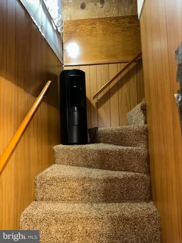 a view of swimming pool with seating area and garden