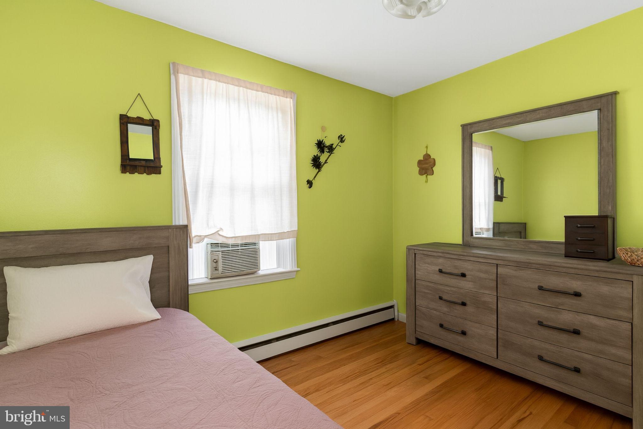 1747 Brookview Road Baltimore, MD 21222 - Photo 7 of 13 a bedroom with a bed and a dresser