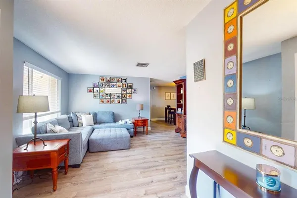 a living room with furniture and a window