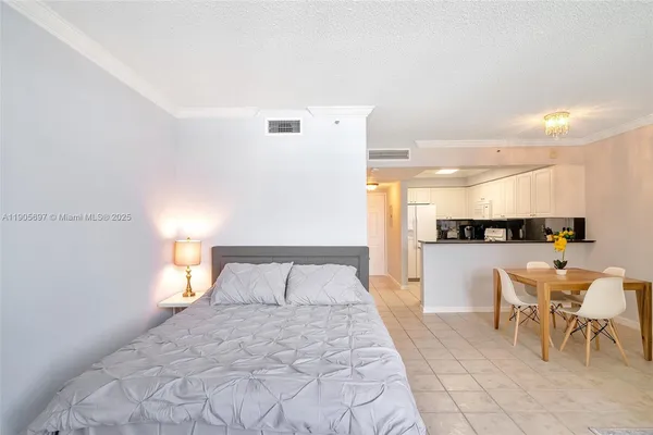 a bedroom with a bed and a view of bathroom