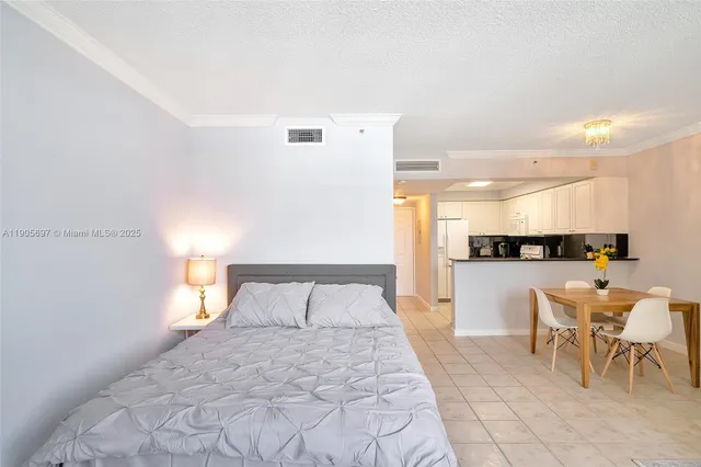 a bedroom with a bed and a view of bathroom