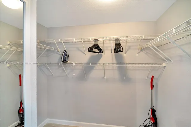 a swimming pool with outdoor seating and a garden