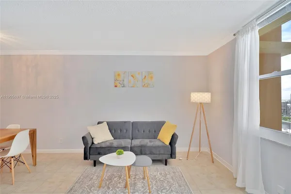 a living room with furniture and a table