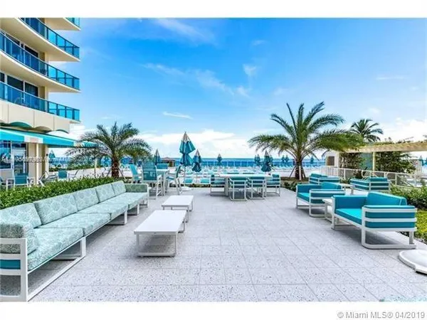 a view of a swimming pool with chairs