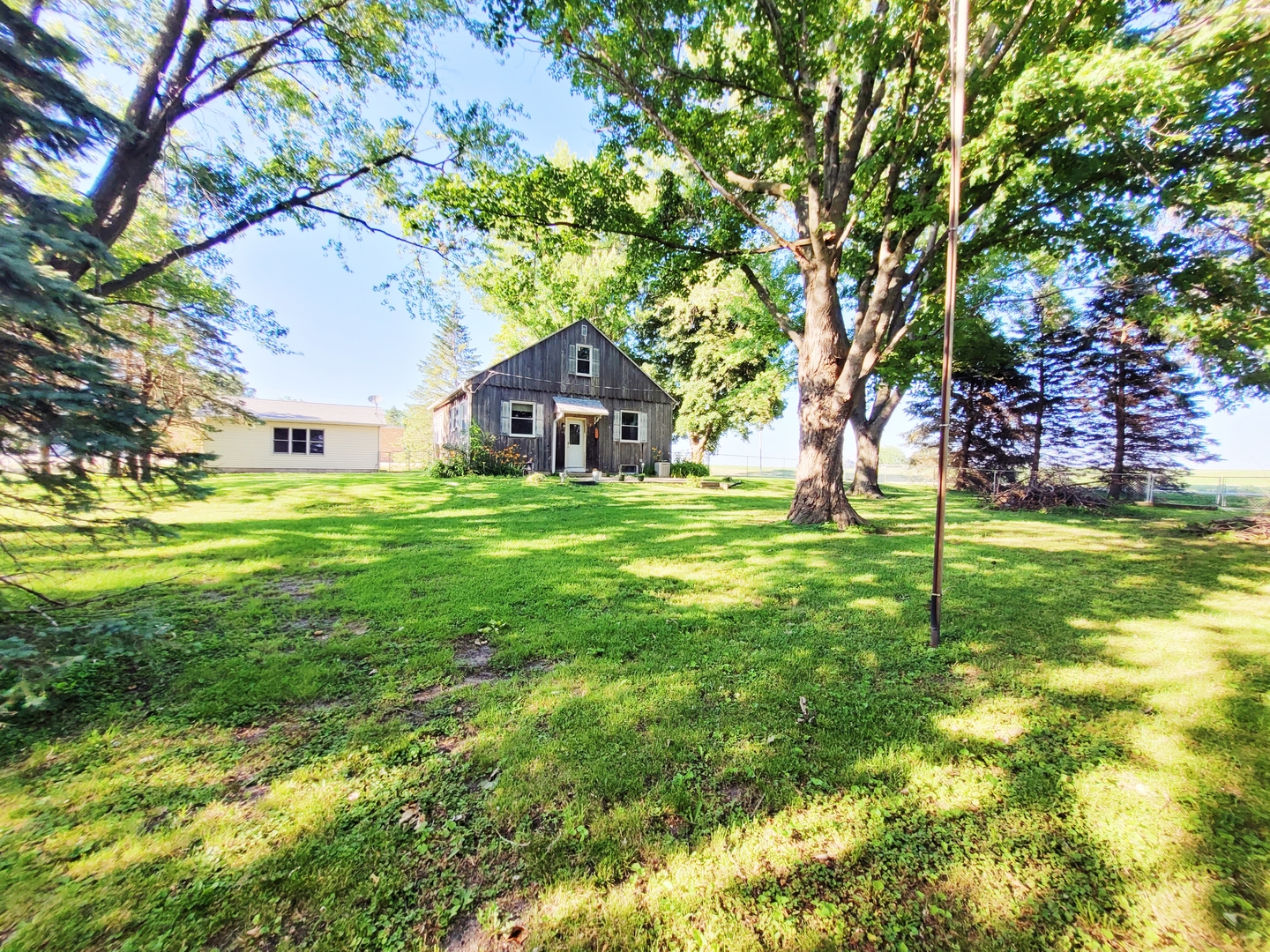 11393 Ward Road Morrison, IL 61270 - Photo 3 of 22 a house view with a sitting space and garden view