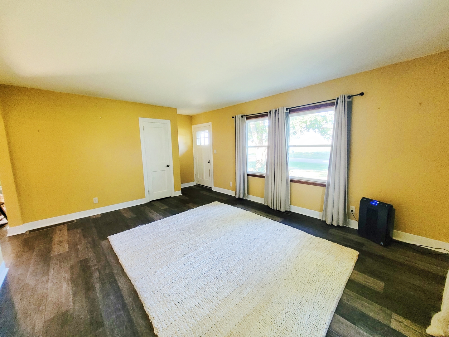 11393 Ward Road Morrison, IL 61270 - Photo 8 of 22 a spacious bedroom with a bed and wooden floor