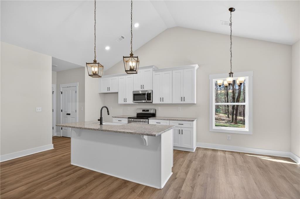 57 Oak Grove Road Taylorsville, GA 30178 - Photo 22 of 42 a kitchen with kitchen island a sink stainless steel appliances and cabinets