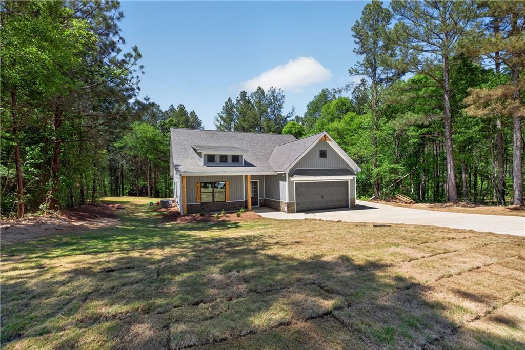 57 Oak Grove Road Taylorsville, GA 30178 - Photo 3 of 42 a house with a outdoor space