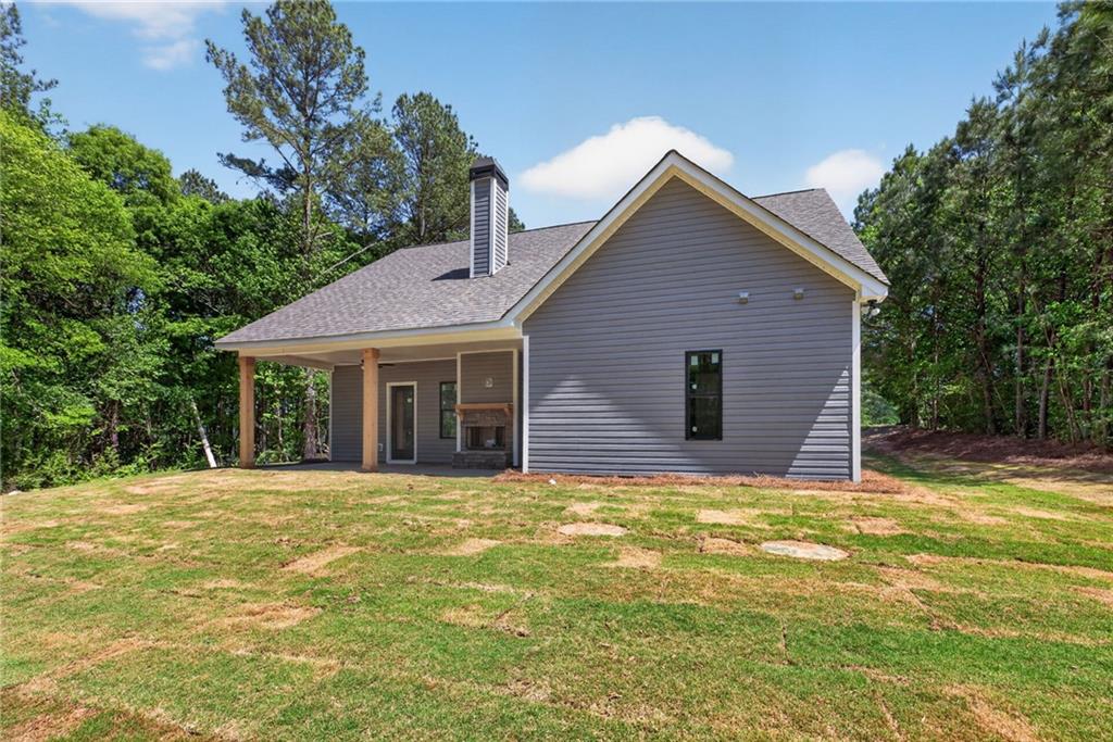 57 Oak Grove Road Taylorsville, GA 30178 - Photo 36 of 42 a view of a house with a yard