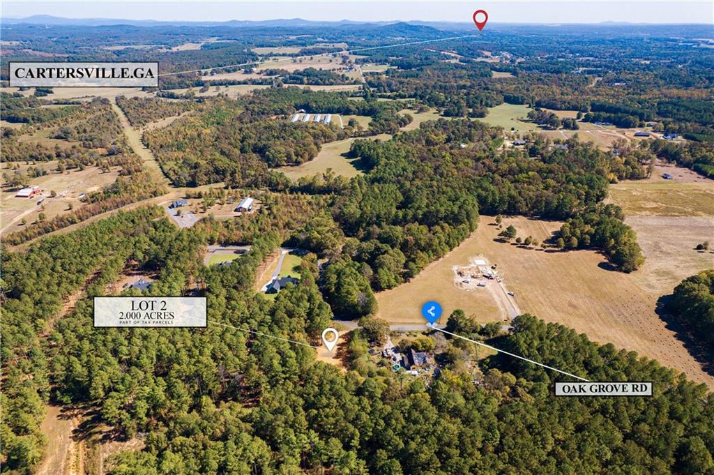 57 Oak Grove Road Taylorsville, GA 30178 - Photo 40 of 42 an aerial view of residential house with parking and yard