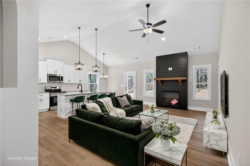 57 Oak Grove Road Taylorsville, GA 30178 - Photo 8 of 42 a living room with furniture and a fireplace