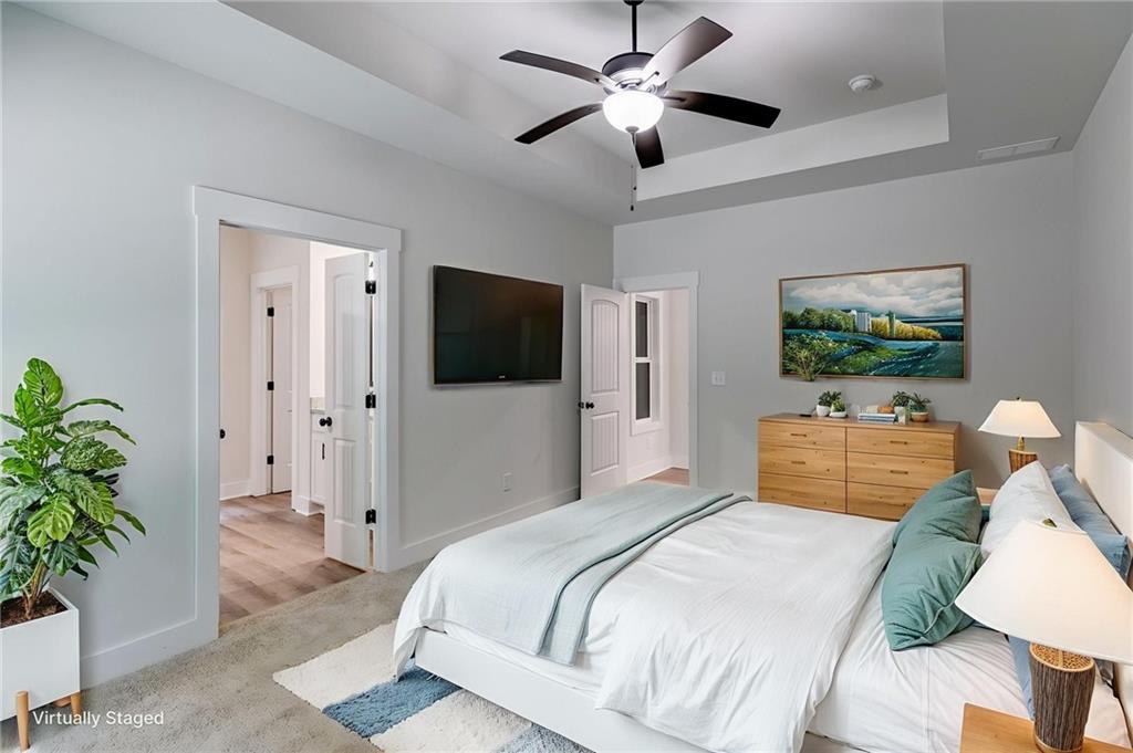 57 Oak Grove Road Taylorsville, GA 30178 - Photo 10 of 42 a bedroom with a large bed and a chandelier