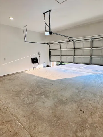 a view of a room with a sink and wooden floor