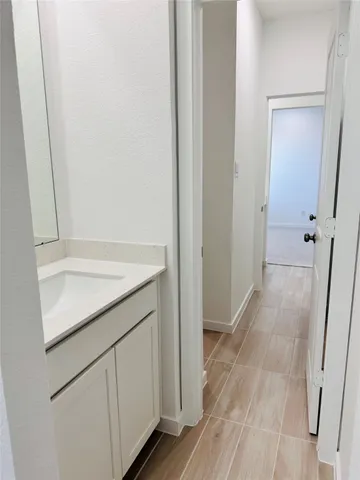 a bathroom with a toilet a sink and bathtub